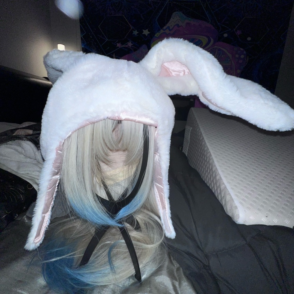 Super cute bunny hat; colors are powder pink and white.